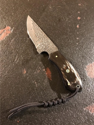 Knife with shiny brown handle